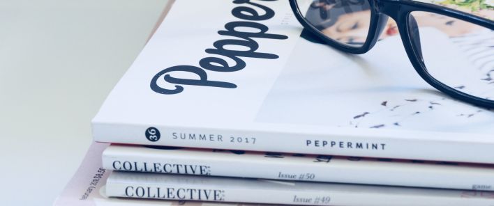 Photo of Eyeglasses On Top of Magazines